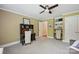Bedroom featuring a desk, built-in shelves, neutral walls, and ceiling fan at 4824 Waxhaw Farms Rd, Waxhaw, NC 28173
