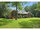Charming single-story brick home with manicured front lawn and mature trees at 4824 Waxhaw Farms Rd, Waxhaw, NC 28173