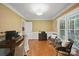 Comfortable living room with ample lighting, hardwood floors and a cozy seating arrangement at 4824 Waxhaw Farms Rd, Waxhaw, NC 28173