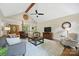 Spacious living room with vaulted ceiling, wood beams, and ample seating, creating a warm and inviting atmosphere at 4824 Waxhaw Farms Rd, Waxhaw, NC 28173