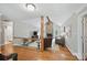 Open living room with vaulted ceiling, stone fireplace, and hardwood floors, perfect for entertaining at 4824 Waxhaw Farms Rd, Waxhaw, NC 28173