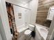 This bathroom has a shower and tub combination, with upgraded lighting and vanity at 5017 Celeste Ct, Charlotte, NC 27609