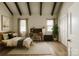 Bright bedroom boasts wood floors, vaulted ceiling, and a cozy bed and desk setup at 5017 Celeste Ct, Charlotte, NC 27609