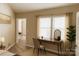 Bright bedroom featuring natural light from two windows and minimalist decor at 5017 Celeste Ct, Charlotte, NC 27609
