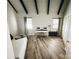 Bedroom with a bed, a desk, and black accent beams in the ceiling at 5017 Celeste Ct, Charlotte, NC 27609