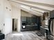 Kitchen with vaulted ceilings, stainless steel appliances, an island, and white hardwood floors at 5017 Celeste Ct, Charlotte, NC 27609