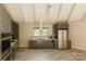 Stylish kitchen featuring stainless steel appliances, gray cabinetry, and plenty of light at 5017 Celeste Ct, Charlotte, NC 27609