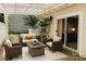 Cozy outdoor patio with modern seating, a fire pit, and lush greenery at 5017 Celeste Ct, Charlotte, NC 27609