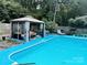 Backyard pool with gazebo and lounge chairs, perfect for outdoor entertaining at 5017 Celeste Ct, Charlotte, NC 27609