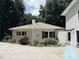Back of house featuring red shutters, green yard, with the bonus of a garage at 5017 Celeste Ct, Charlotte, NC 27609