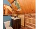 This is a full bathroom with a wooden ceiling, mirror, toilet, and sink at 5109 Walnut Grove Ln, Charlotte, NC 28227