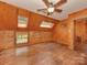 This is a bedroom with a wooden floor, walls, ceiling fan, and skylights at 5109 Walnut Grove Ln, Charlotte, NC 28227