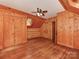 Charming wood-paneled bedroom with a ceiling fan and natural light at 5109 Walnut Grove Ln, Charlotte, NC 28227