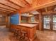 Open kitchen area with bar seating, cabinets, wood counters, and access to a deck at 5109 Walnut Grove Ln, Charlotte, NC 28227
