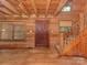 Spacious living room featuring wood walls, wood ceilings, staircase, and natural light at 5109 Walnut Grove Ln, Charlotte, NC 28227