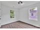 Bedroom boasts two windows, wood-look flooring, natural light at 512 North Mulberry St, Cherryville, NC 28021