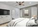 This is a beautifully staged bedroom featuring neutral tones, an elegant dresser and decor at 512 North Mulberry St, Cherryville, NC 28021