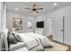 Bright bedroom features a ceiling fan, plush bedding, and a soothing, neutral color palette at 512 North Mulberry St, Cherryville, NC 28021