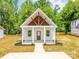 New construction home with a charming covered front porch and well-manicured landscaping at 512 North Mulberry St, Cherryville, NC 28021