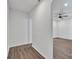 Bright hallway with wood-look flooring leads to bedroom with ceiling fan at 512 North Mulberry St, Cherryville, NC 28021