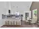 Modern eat-in kitchen boasts stainless steel appliances, sleek countertops, and lots of natural light at 512 North Mulberry St, Cherryville, NC 28021