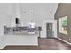 Modern kitchen with granite countertops, stainless steel appliances, and gray backsplash at 512 North Mulberry St, Cherryville, NC 28021