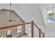 View from the landing, featuring a vaulted ceiling and an outdoor view at 512 North Mulberry St, Cherryville, NC 28021