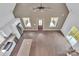 Aerial view of living room featuring vaulted ceiling, modern kitchen with stainless steel appliances at 512 North Mulberry St, Cherryville, NC 28021