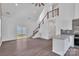 Open floor plan with modern staircase, sliding glass doors, and a kitchen with a peninsula at 512 North Mulberry St, Cherryville, NC 28021
