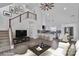 Bright, open-concept living room with stairs, modern furnishings, and plenty of natural light at 512 North Mulberry St, Cherryville, NC 28021