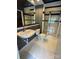 This bathroom has tile floors and walls, and a shower with a glass door at 514 W 10Th St # 403, Charlotte, NC 28202
