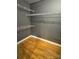 This walk-in closet offers shelving and wood flooring at 514 W 10Th St # 403, Charlotte, NC 28202