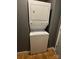 This laundry area features a stackable washer and dryer at 514 W 10Th St # 403, Charlotte, NC 28202