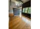 This living room features hardwood floors, neutral paint, and oversized windows that let in lots of light at 514 W 10Th St # 403, Charlotte, NC 28202