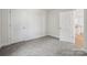 Bright bedroom with neutral carpet and trim, offering a versatile space at 54 Reed Ne St, Concord, NC 28025