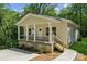 Charming home with a welcoming porch, manicured landscaping, and beautiful curb appeal at 54 Reed Ne St, Concord, NC 28025