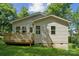 Well-manicured lawn and a home exterior featuring a new deck at 54 Reed Ne St, Concord, NC 28025