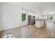 Open concept kitchen and dining area with wood floors and stainless steel appliances at 54 Reed Ne St, Concord, NC 28025