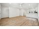 Spacious living room with a view of the kitchen, with an open design and contemporary flooring at 54 Reed Ne St, Concord, NC 28025