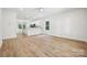 Open living area with bright, neutral walls and modern floors, creating a versatile space at 54 Reed Ne St, Concord, NC 28025