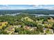 Aerial view of a new lakefront community, surrounded by mature trees and blue water at 6249 Hayden Dr, Hickory, NC 28601