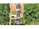 Aerial view of a new home nestled among mature trees. White property line added at 6249 Hayden Dr, Hickory, NC 28601