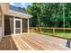 Wooden back deck featuring cable railing, a screened porch, and lush landscaping at 6249 Hayden Dr, Hickory, NC 28601