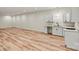 Basement kitchenette features white cabinets, countertops, and a sleek black faucet at 6249 Hayden Dr, Hickory, NC 28601