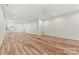 Spacious basement with light wood-look flooring, recessed lighting, and a kitchenette in the corner at 6249 Hayden Dr, Hickory, NC 28601