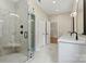 Modern bathroom featuring glass-enclosed shower with marble tiling, double sink and lots of room at 6249 Hayden Dr, Hickory, NC 28601