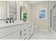 Well-lit bathroom with a double vanity, modern fixtures, and a tiled shower with glass door at 6249 Hayden Dr, Hickory, NC 28601