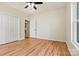 Light-filled bedroom with hardwood floors, ceiling fan, closet, and natural light from the window at 6249 Hayden Dr, Hickory, NC 28601