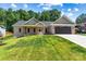 Lovely brick home with a covered front porch and an attached garage, blending charm and practicality seamlessly at 6249 Hayden Dr, Hickory, NC 28601
