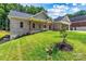 Beautiful brick home featuring a cozy front porch, perfect for enjoying quiet evenings in a serene setting at 6249 Hayden Dr, Hickory, NC 28601